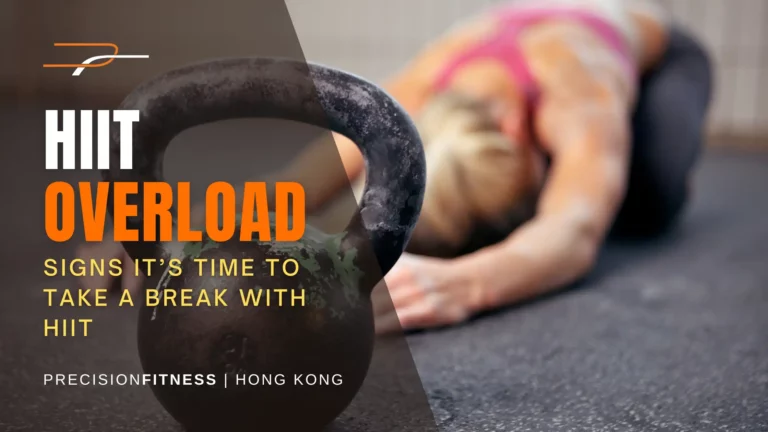 Woman on her knees training and why you should stop hiit training and when to take a break text over it