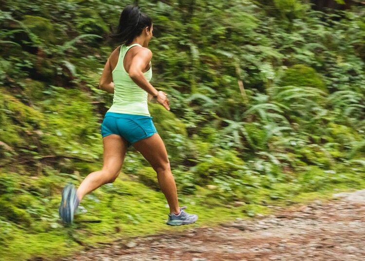 Woman running on the forrest track