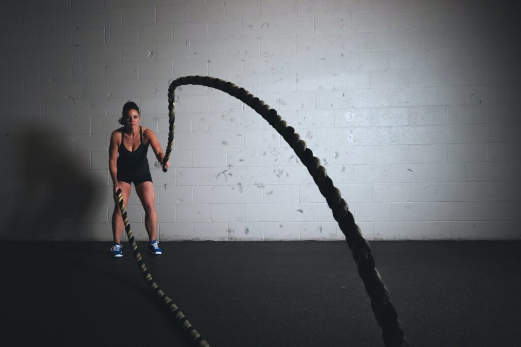 Woman training with the ropes