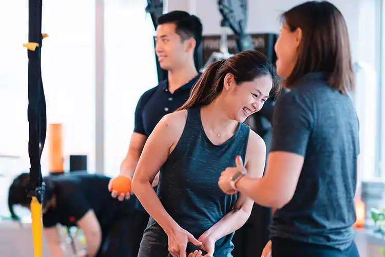 Happy Lady workout at Precision Fitness HK. Fitness Training Hong Kong.